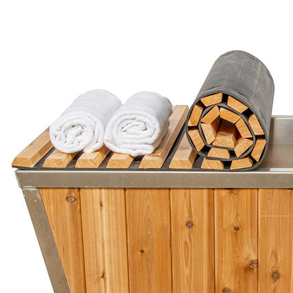 Knotty cedar roll up cover for a cold plunge tub