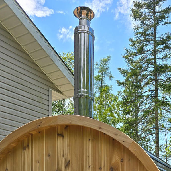 Chimney kit venting out the top of a sauna
