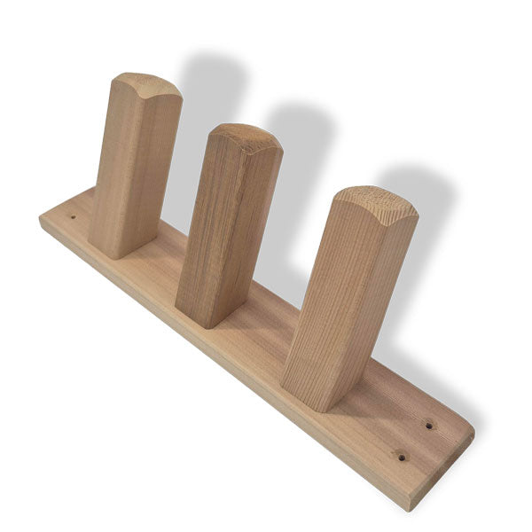 Three-peg cedar towel hooks for an outdoor shower