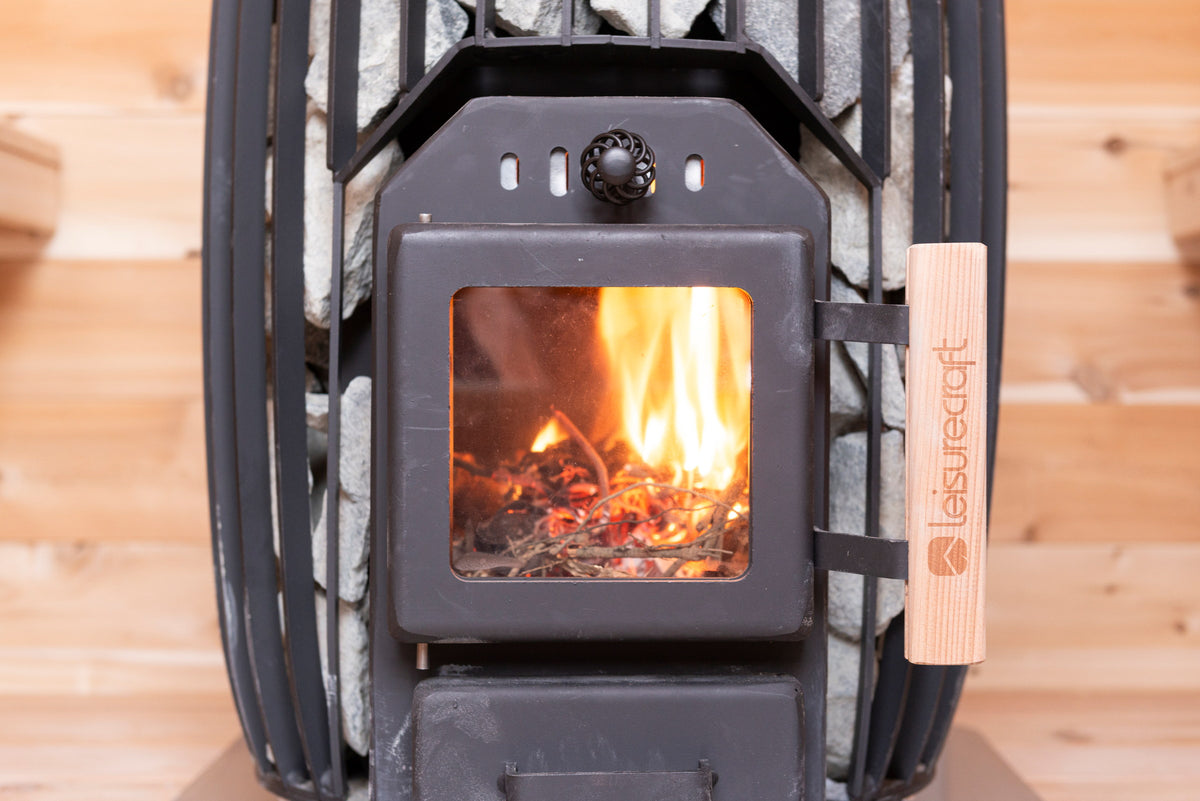 Wood-burning stove lit inside the CT Elation sauna