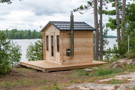 CT Georgian cabin sauna in Eastern White Cedar, three-quarter view on a lakeside deck