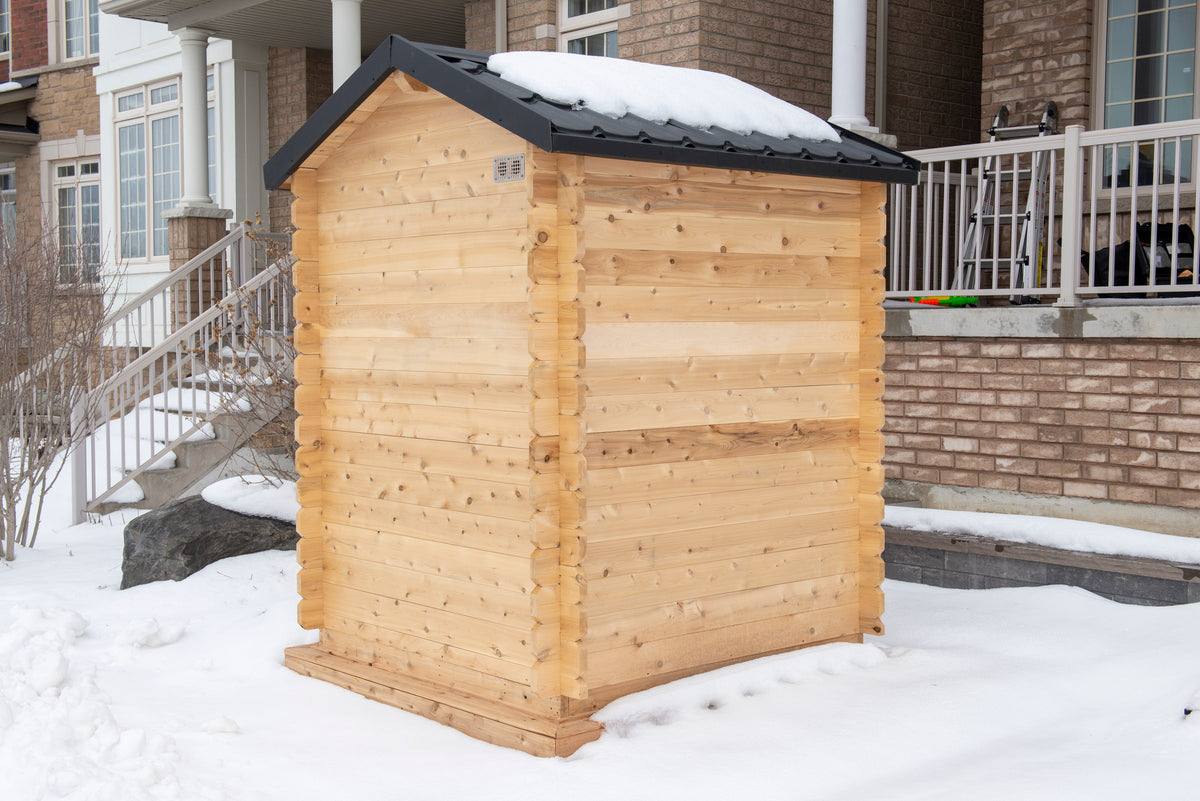 CT Granby cabin sauna installed beside a brick home in winter