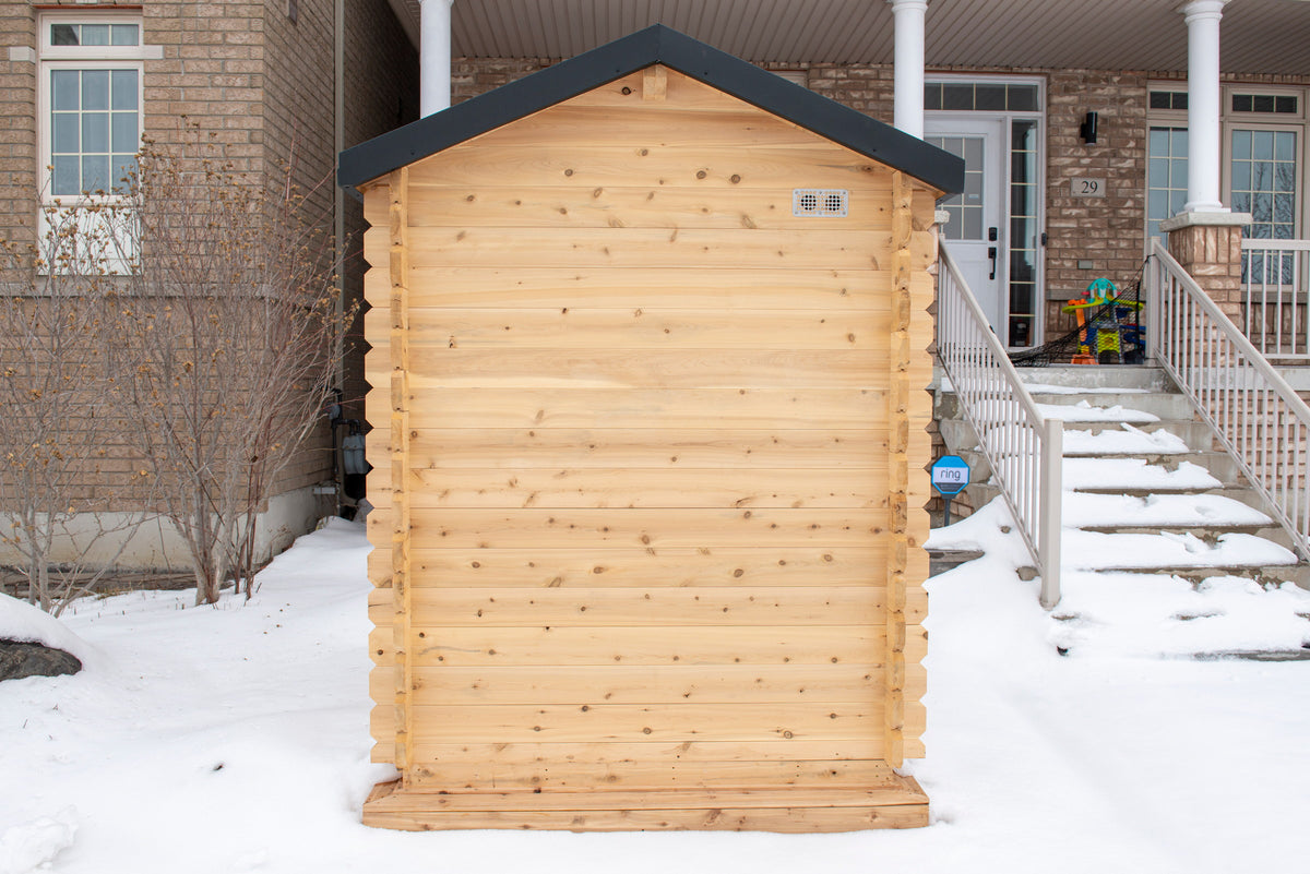 CT Granby cabin sauna beside a home, angled view showing its compact footprint