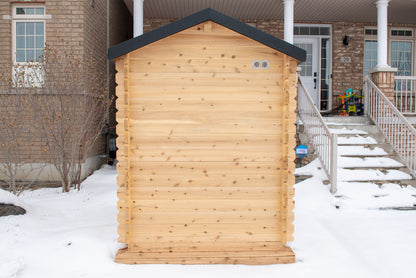 CT Granby cabin sauna beside a home, angled view showing its compact footprint