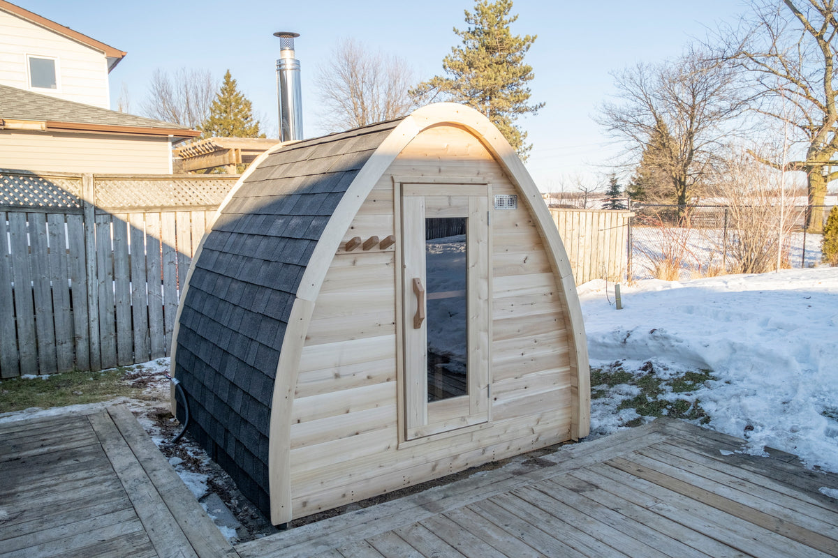 CT MiniPOD cedar sauna, three-quarter exterior view showing the curved pod roofline