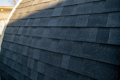 Asphalt shingle roof detail following the curve of the CT MiniPOD sauna