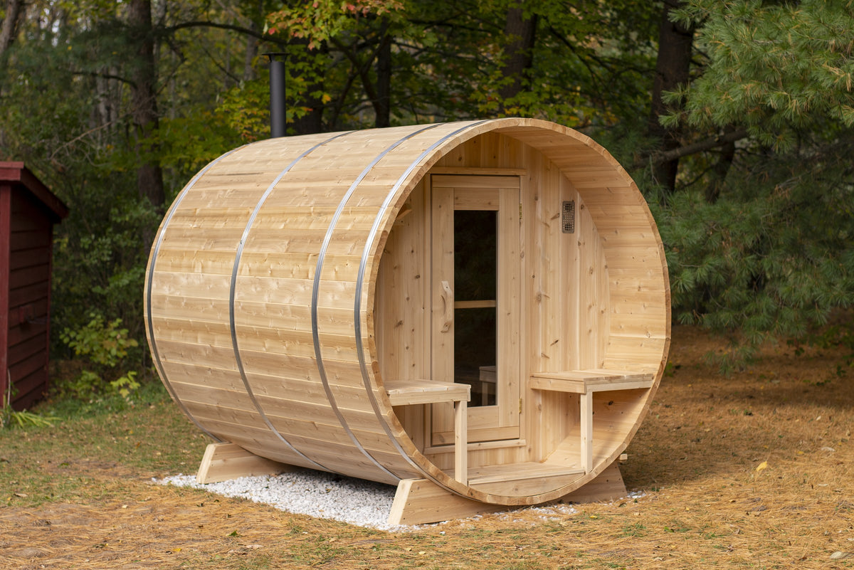 CT Serenity barrel sauna in eastern white cedar, three-quarter exterior view with covered porch