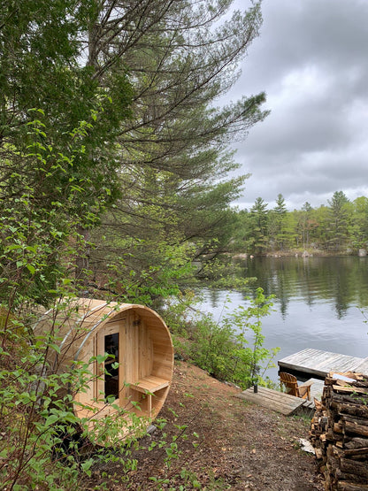 CT Serenity outdoor sauna sited on a wooded shoreline overlooking the water